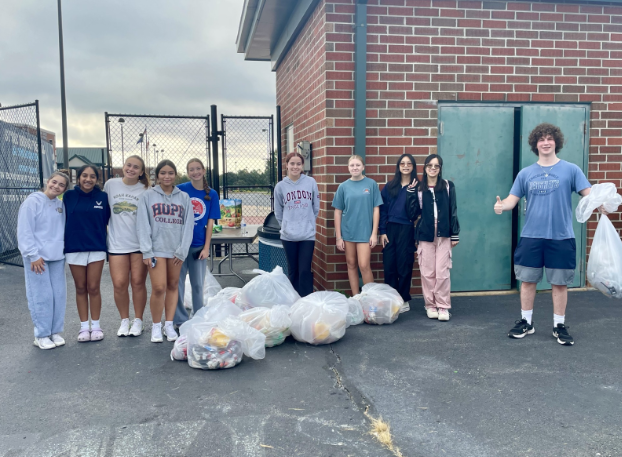 Key Club Volunteers Tackle Stadium Clean-Ups